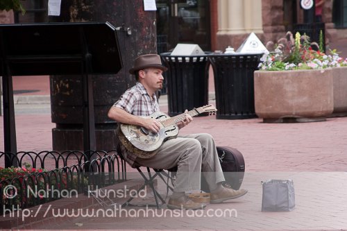 A guitar player on the Pearl Street Mall in Boulder, CO
